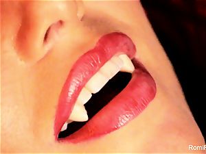 Romi the buxom vampire has a warm solo session