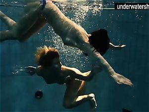 two wondrous amateurs showing their bodies off under water