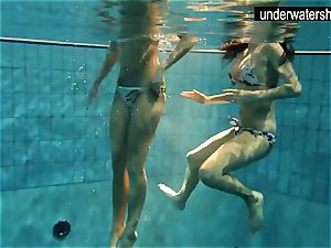two wondrous amateurs showing their bodies off under water